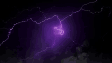 a purple lightning bolt in a dark sky