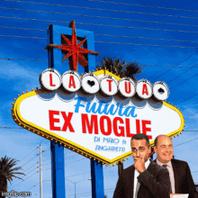 two men are standing under a sign that says laotua futura ex moglie