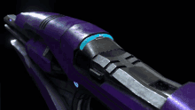 a close up of a purple object with a blue light coming out of it