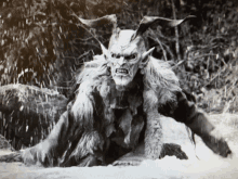 a black and white photo of a monster with horns and a furry coat