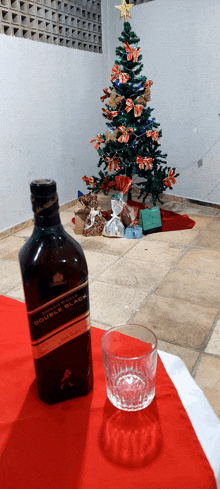 a bottle of johnnie walker double black sits on a table