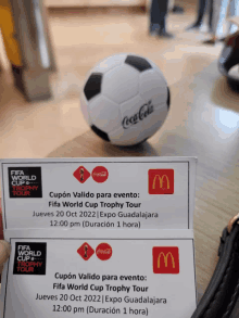 two tickets for the fifa world cup trophy tour are on a table