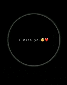 a black background with the words `` i miss you '' and a heart in the middle .