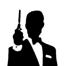 a man in a tuxedo is holding a gun .