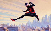 a spiderman is jumping in the air in front of a city .