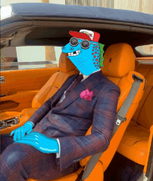 a man in a suit and hat is sitting in a rolls royce