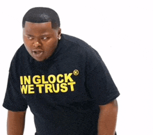 a man wearing a shirt that says in glock we trust