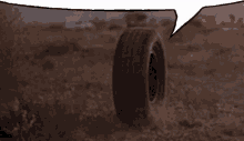 a tire is laying on the ground with a speech bubble in the background