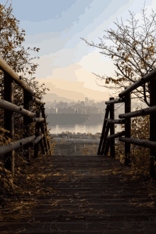 a wooden walkway leading to a lake with a city in the background