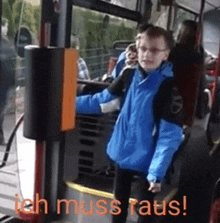 a man in a blue jacket is sitting on a bus with the words ich muss raus written in orange