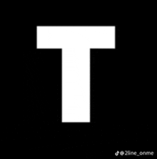 the letter t is a white letter on a black background .