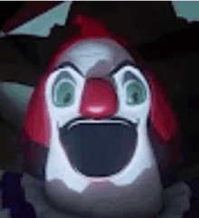 a close up of a clown 's face with a big mouth and green eyes .