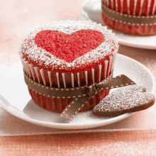 a cupcake with a heart drawn on it