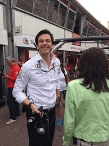 a man in a white shirt with the word mercedes on his shirt