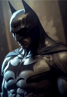 a close up of a statue of batman with a star on his chest