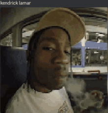 a pixelated image of a man wearing a hat with the name kendrick lamar at the top