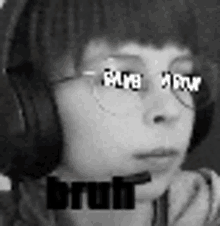 a black and white photo of a person wearing headphones and glasses with the word bruh on the bottom .