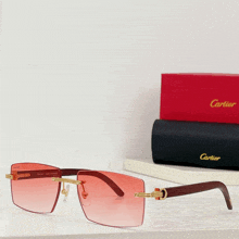 a pair of cartier sunglasses are sitting on a table