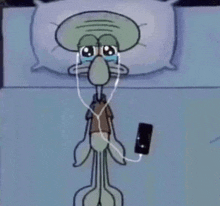 squidward from spongebob squarepants is crying while listening to music on his phone .