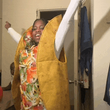 a woman is dressed in a taco costume