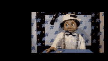 a puppet is wearing a white hat and suspenders that say " piano "