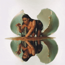 a woman is kneeling in a broken egg with her reflection in the water