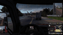 a screenshot of a video game shows a dashboard and a steering wheel