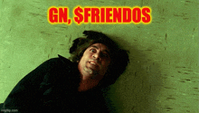 a man laying on the floor with the words gn , $friends written above him