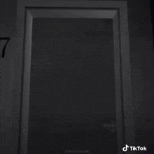 a black door with a number 7 on it