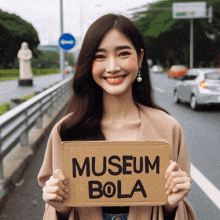 a woman is holding a sign that says museum bola