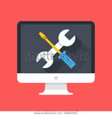 a computer monitor with a wrench , screwdriver , and pencil on it .