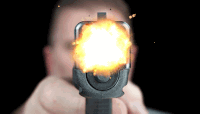 a man is pointing a gun with a bullet coming out of it