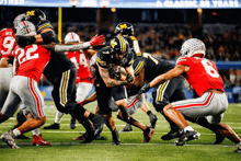 a football game is being played in front of a sign that says a classic 50 years