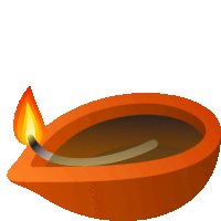 an orange bowl with a lit candle inside