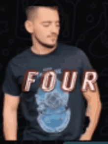 a man wearing a black shirt that says four