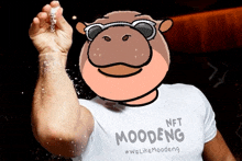 a man wearing a t-shirt that says moodeng