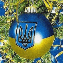 a blue and yellow christmas ball with a coat of arms on it