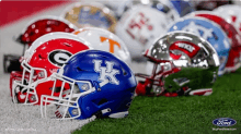 a row of football helmets including one that says uk