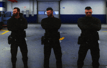 three men in black uniforms are standing in a parking garage