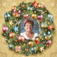 a woman is in a christmas wreath with decorations