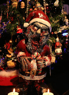 a statue of a zombie santa claus is holding a candy cane in front of a christmas tree