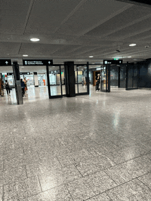 a large empty room with a sign that says airport vip service