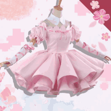 a pink dress with white gloves is on a mannequin with flowers in the background