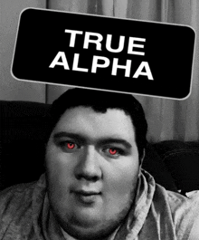 a man with red eyes is wearing a true alpha sign on his head