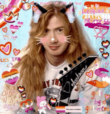 a man with long hair is holding a jackson guitar and wearing cat ears