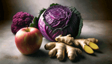 an apple cabbage and ginger on a table