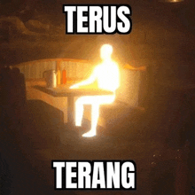 a person is sitting at a table with a light coming out of them and the words terus terang above them