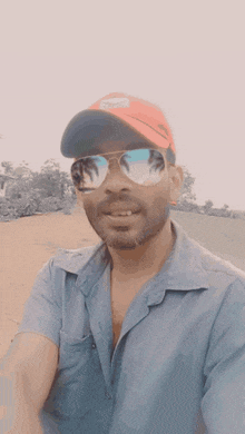 a man wearing sunglasses and a hat that says ' nike ' on it