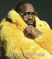 a man wearing a yellow fur coat with the words flex on these kids