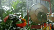 elmo from sesame street is playing a drum set